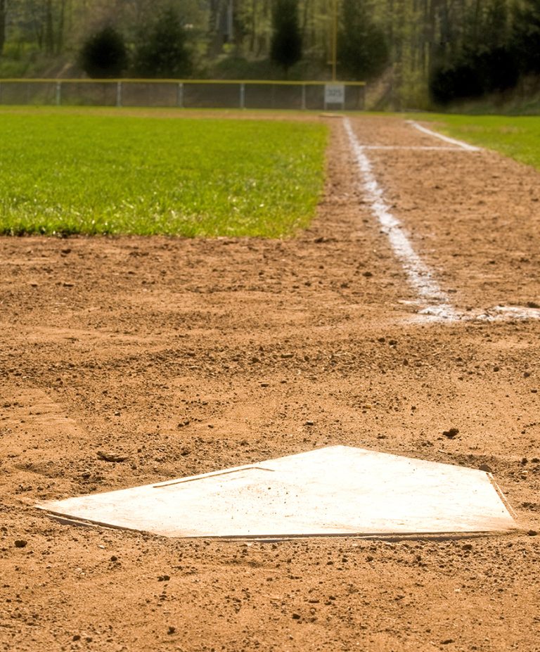 Home plate on a baseball field with selective focus